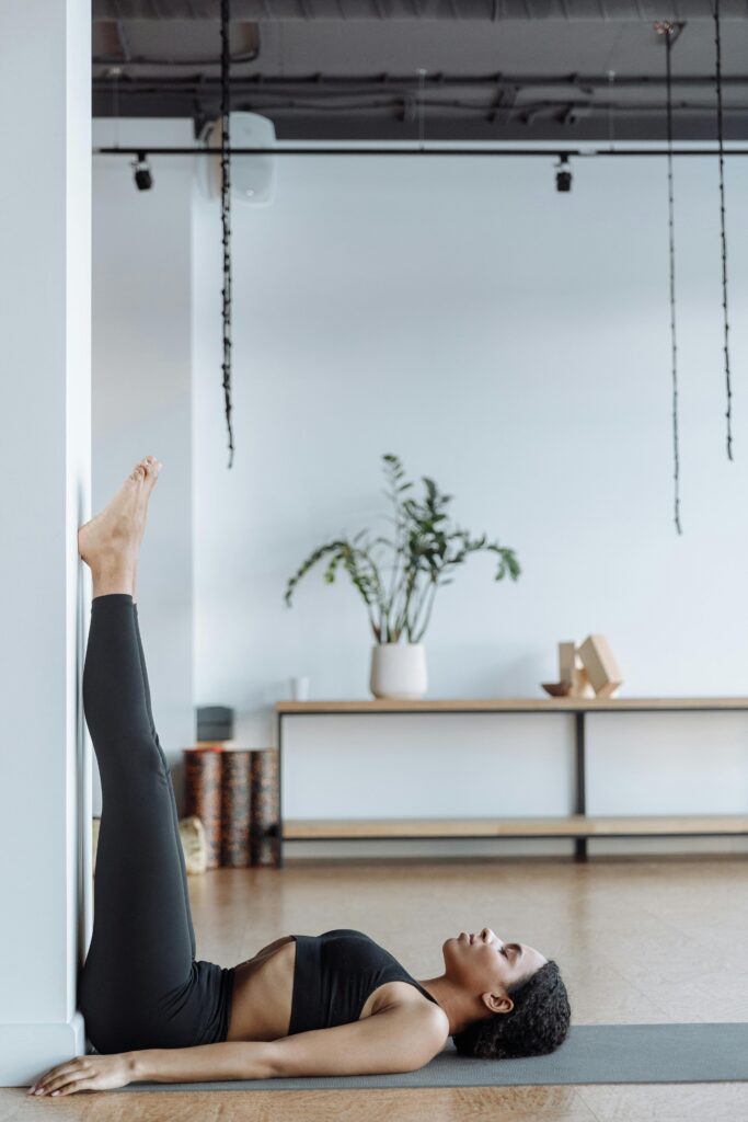 Viparita Karani (Legs Up the Wall) yoga pose for improving circulation and reducing stress, perfect for relaxation and restful sleep.